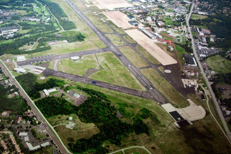 A 2014 photograph of the Willow Grove air base hangs in the Horsham Township Building. ( DAVID SWANSON / Staff Photographer )