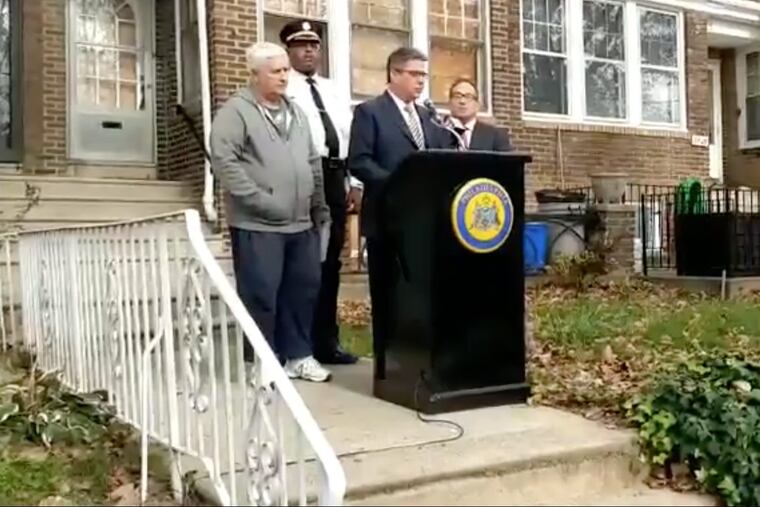 Councilman Bobby Henon speaks at Oct. 19 news conference in front of 3427 Princeton Avenue. Also speaking were (from left): George Keefer, the brother of the owner of the property; Philadelphia Police Department Chief Inspector Carl Holmes, and City Councilman David Oh.