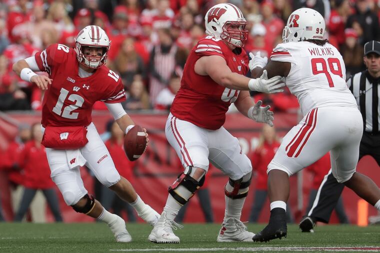 Alex Hornibrook (left) has entered the NCAA transfer portal.