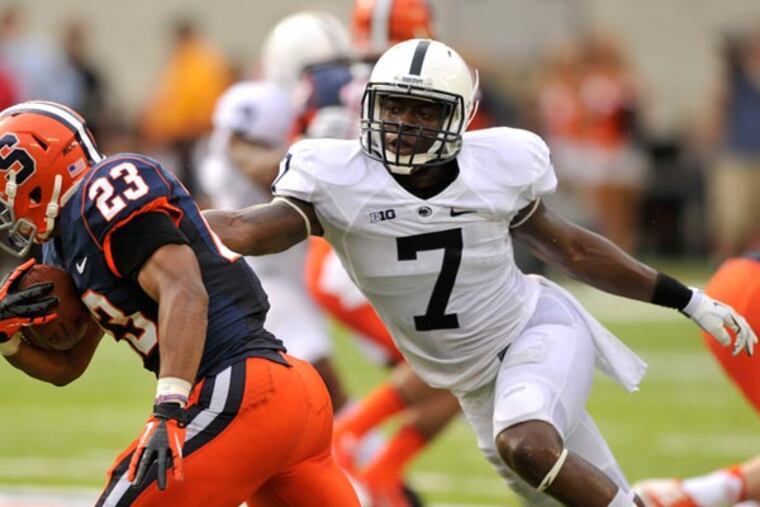 Penn State's Stephen Obeng-Agyapong tackles Prince-Tyson Gulley during
an NCAA college football game, Saturday, Aug. 31, 2013, in East Rutherford, N.J. Penn State won 23-17. (AP Photo/Centre Daily Times,
Nabil K. Mark)