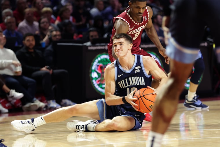 Angelo Brizzi of Villanova comes up with a loose ball in front of Temple's Hysier Miller on Nov. 11, 2022.