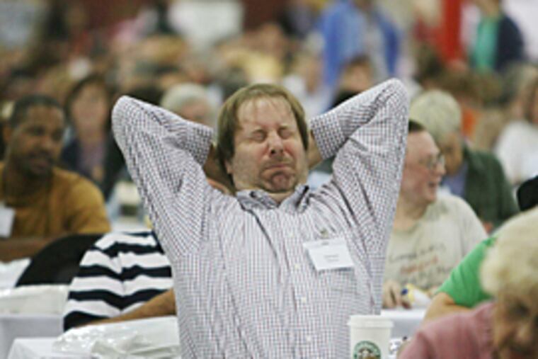 A contestant stretches while competing Saturday at the Convention Center.