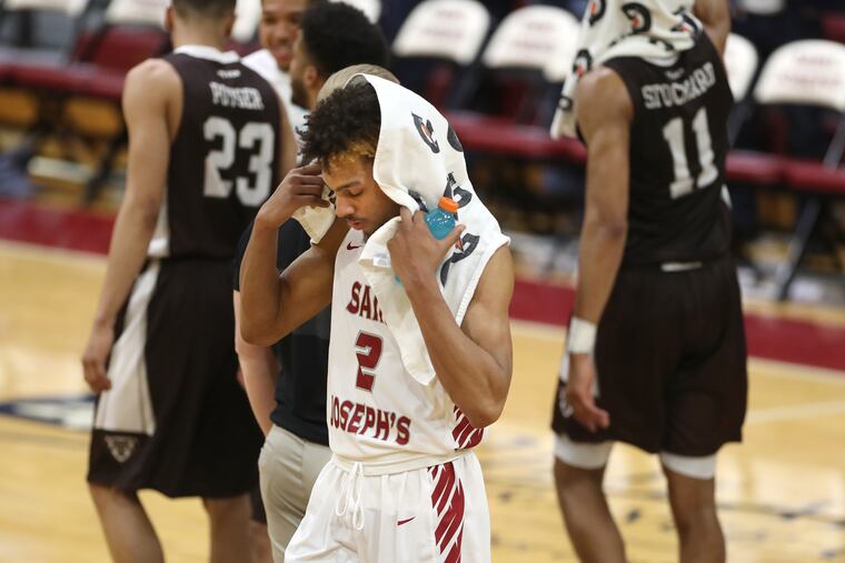 Charlies Brown of St. Joseph’s walks off the court after their loss to St. Bonaventure on Feb. 12, 2019.