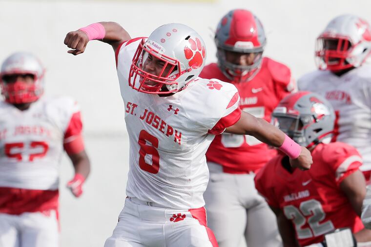 St. Joseph’s Kevin Mayfield clebrates his hit on Vineland’s Tyreem Powell (22) in the fourth quarter.