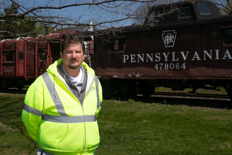 Mark Arnold, Telecommunications Director for Kutztown, poses for a portrait in front of the historic train station in Kutztown, Pa. on Friday, April 23, 2021. President Joe Biden’s $2 trillion infrastructure plan aims to expand internet access by building more publicly-owned broadband networks. Kutztown runs one of 200 city-wide broadband networks across the country that offer internet service.