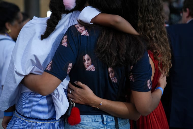 Supporters of Vice President Kamala Harris embrace on Nov. 6 as she delivers a concession speech on the campus of Howard University in Washington.