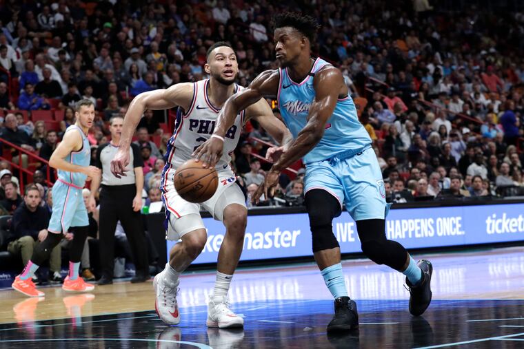 Jimmy Butler drives past Ben Simmons during the second half.