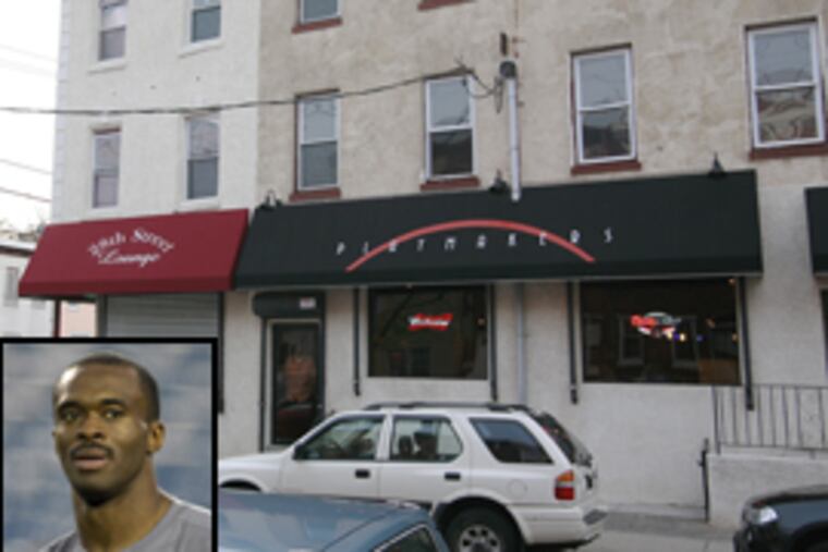 Playmakers bar at 28th and Cambridge streets, which is owned by NFL wide receiver Marvin Harrison (inset), who was questioned in an investigation into a shooting.