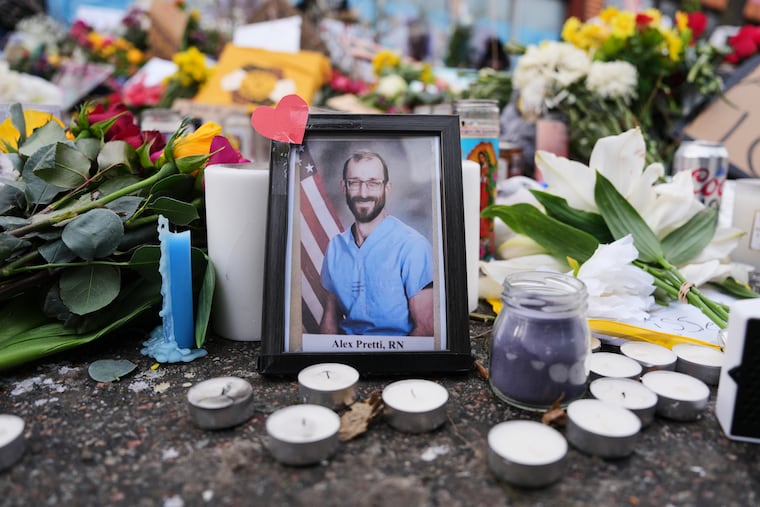 A photo of 37-year-old Alex Pretti, who was fatally shot by a U.S. Border Patrol officer over the weekend, is displayed at the shooting scene Monday, in Minneapolis.
