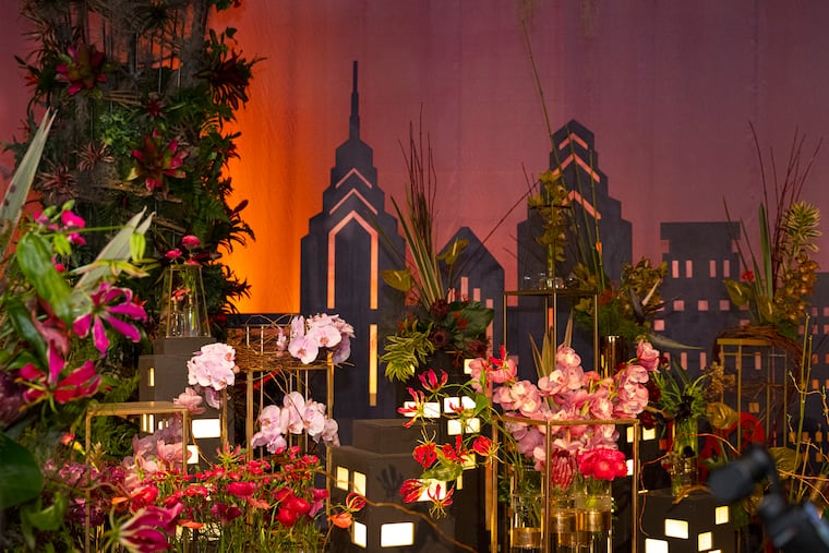 A display name Trending our Roots is shown at the Philadelphia Flower Show, which opened to the public on Saturday.