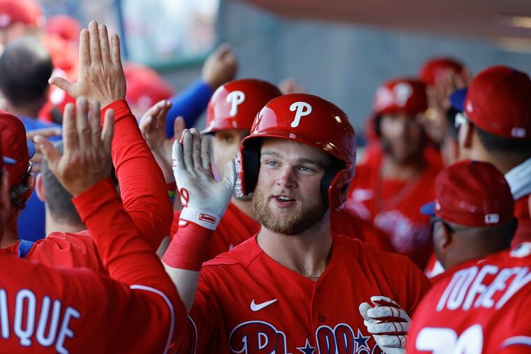 Phillies Ethan Wilson celebrates his sixth inning grand slam home run with his teammates.