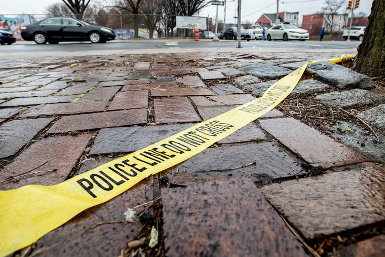 Yellow Philadelphia Police tape on the ground in Philadelphia
