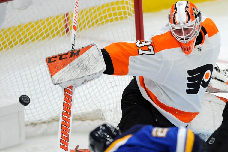 St. Louis Blues' Alexander Steen (20) scores on Philadelphia Flyers' Brian Elliott (37) during the first period of an NHL hockey game, Thursday, April 4, 2019, in St. Louis. (AP Photo/Bill Boyce)