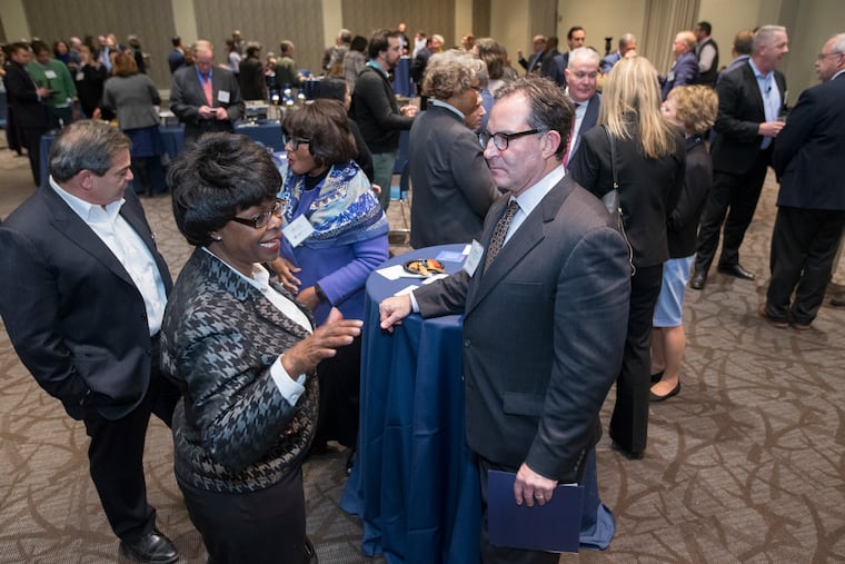 Jeff Hornstein, executive director of the Economy League of Greater Philadelphia, greets a sold-out audience at Wednesday night's launch of Philadelphia Anchors for Growth and Equity, a first-ever citywide effort to get universities and hospitals to buy local.