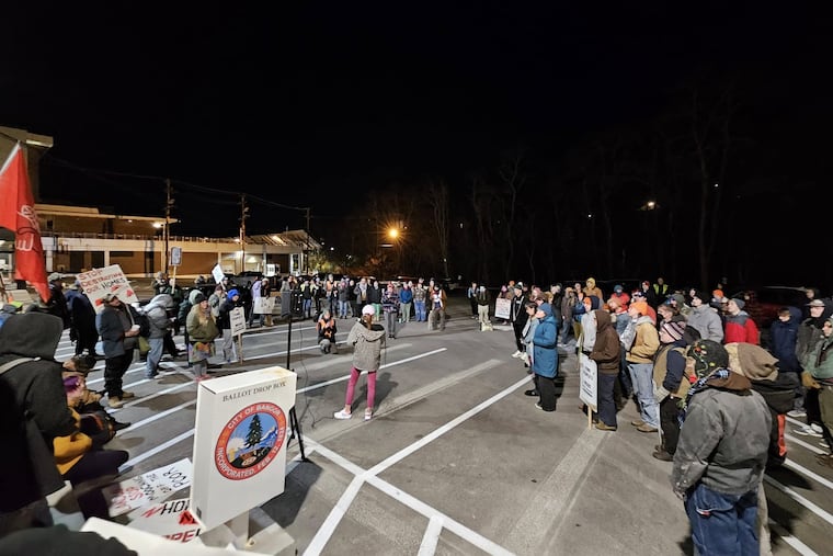 Advocates and homeless people gather outside Bangor City Hall in November 2024 for a "Stop the Sweeps" rally. They asked the City Council not to clear a homeless encampment with about 100 residents. The city swept the encampment in February 2025. (Needlepoint Sanctuary)