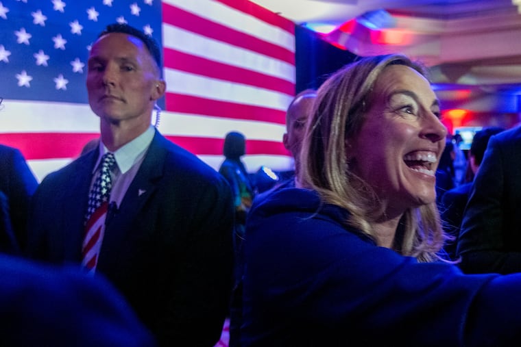 U.S. Rep. Mikie Sherrill greets supporters following her victory speech at her election night party in East Brunswick, N.J., on Tuesday. The Democrat beat Republican Jack Ciattarelli in a landslide to become the next governor of New Jersey.