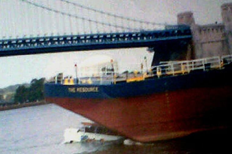 A barge collides with a stalled duck boat Wednesday on the Delaware River in Philadelphia. The collision sent all 37 people aboard the smaller amphibious sightseeing boat overboard, leaving two passengers unaccounted for after a frantic rescue effort. (AP Photo / CBS3 KYW-TV)