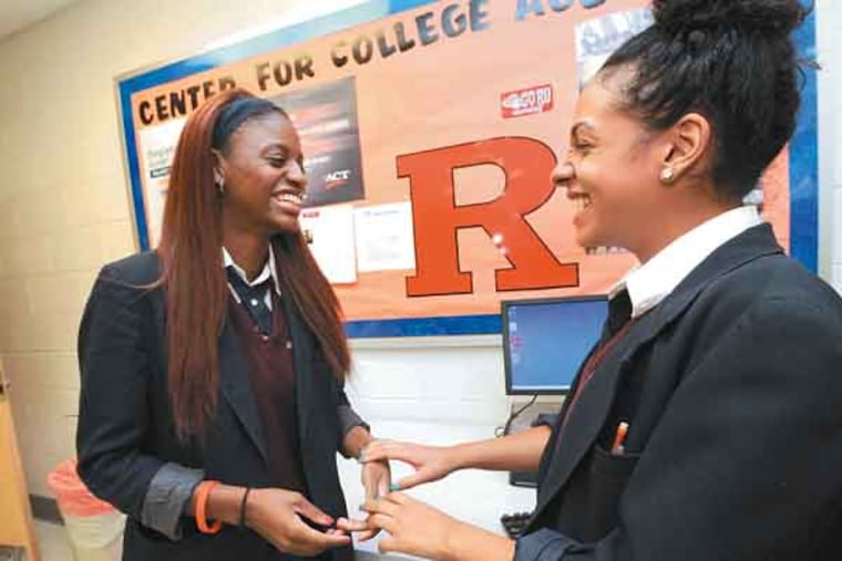 Kids from Future Scholars, a mentoring and scholarship program Rutgers started five years ago, on June 6, 3013. Here, at LEAP Academy, Brianna Walker, left, chats with classmate Geeniva Torres. ( APRIL SAUL / Staff )