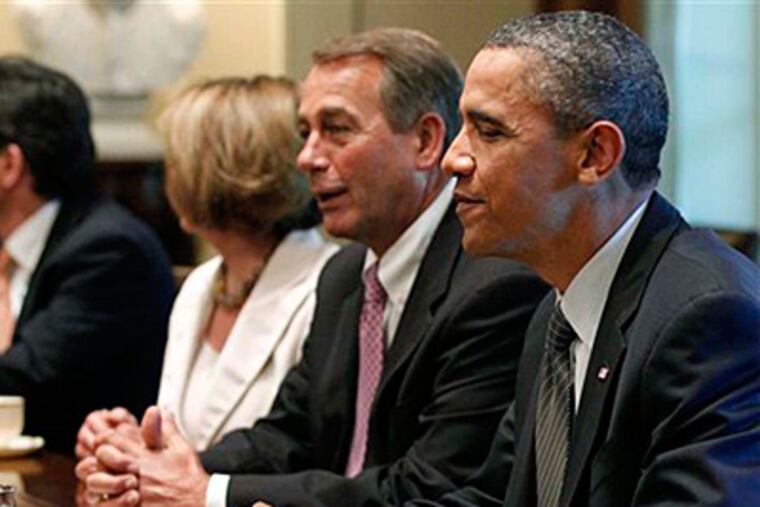 President Barack Obama sits with House Speaker John Boehner of Ohio, and House Minority Leader Nancy Pelosi of California regarding the debt ceiling in the Cabinet Room of the White House on July 14, 2011. (AP Photo/Charles Dharapak)