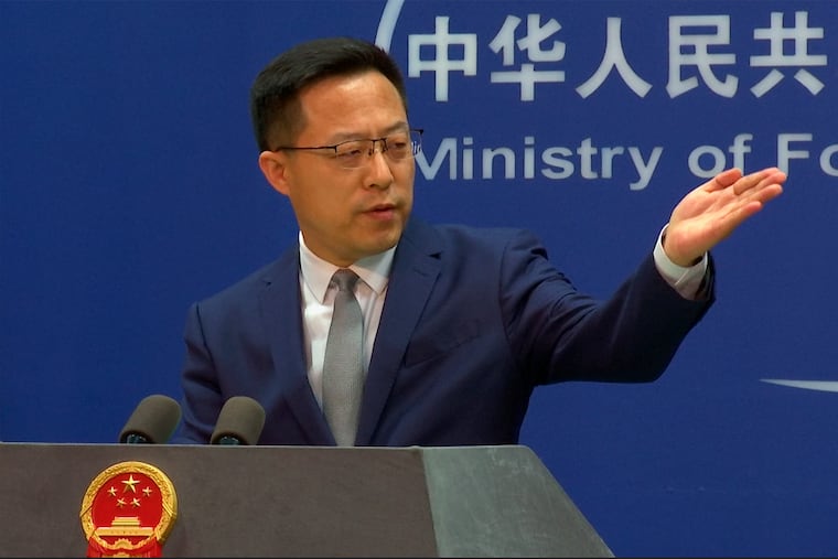 In this image made from video, Chinese Foreign Ministry spokesperson Zhao Lijian gestured during a media briefing at the Ministry of Foreign Affairs office on April 6, 2022, in Beijing.