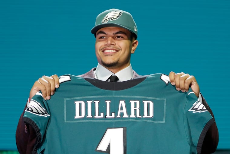 Andre Dillard shows off his new Eagles jersey.