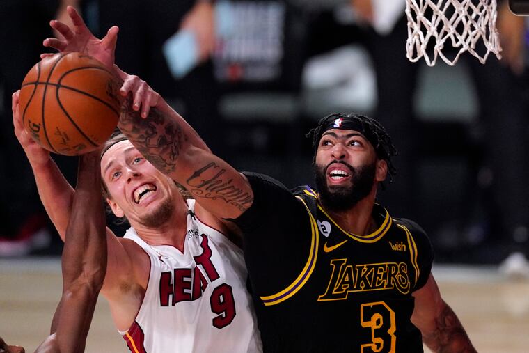 Miami Heat forward Kelly Olynyk (left) and Los Angeles Lakers forward Anthony Davis compete for control of a rebound in the second half.
