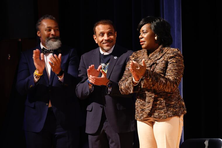 Mayor Cherelle L. Parker, with school board president Reginald Streater and Superintendent Tony B. Watlington Sr., applauds at the Philadelphia School District's State of the Schools event at High School of the Future Thursday.