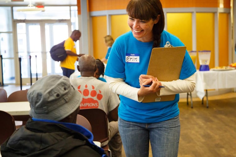 Erin Crean, Director of Camden CountyÕs Office of Community Development, greets an attendee at a resource fair for the homeless which featured a variety of vendors providing services to help homeless individuals, at Cathedral Kitchen in Camden, New Jersey, Wednesday, Sept. 13, 2017. JESSICA GRIFFIN / Staff Photographer
