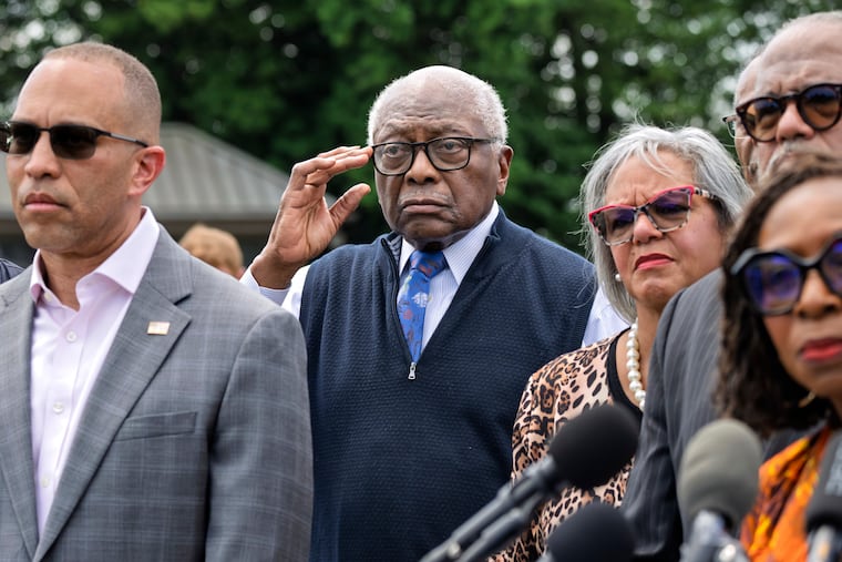 Rep. Jim Clyburn, D-S.C., center, joined by House Minority Leader Hakeem Jeffries, D-N.Y., left, stands with members of the Congressional Black Caucus during an event outside the Capitol in Washington, Tuesday, May 19, 2026.