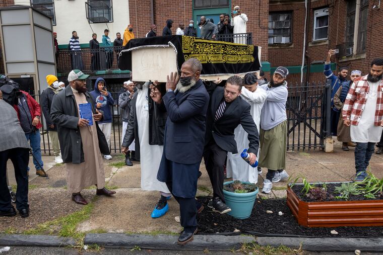 Pallbearers carry the body of Nicolas Elizalde from Philadelphia Masjid, following his funeral service. Elizalde, 14, was killed after a high school football scrimmage at Roxborough High School.
