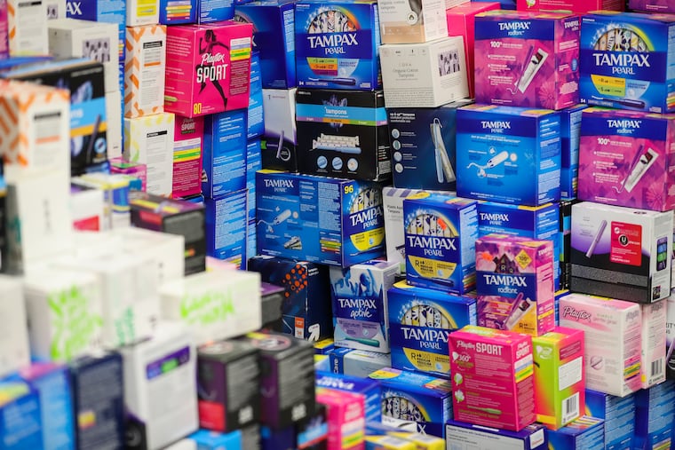 Boxes of tampons are stacked in a room inside the SPOT Period Menstrual Hub in the Germantown section of Philadelphia in 2021.