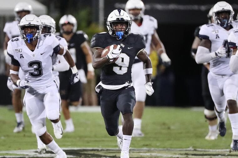 UCF running back Adrian Killins Jr. outruns UConn defenders for a touchdown. Killins is another speed guy signed by the Eagles. He ran a 4.27-second 40-yard dash.