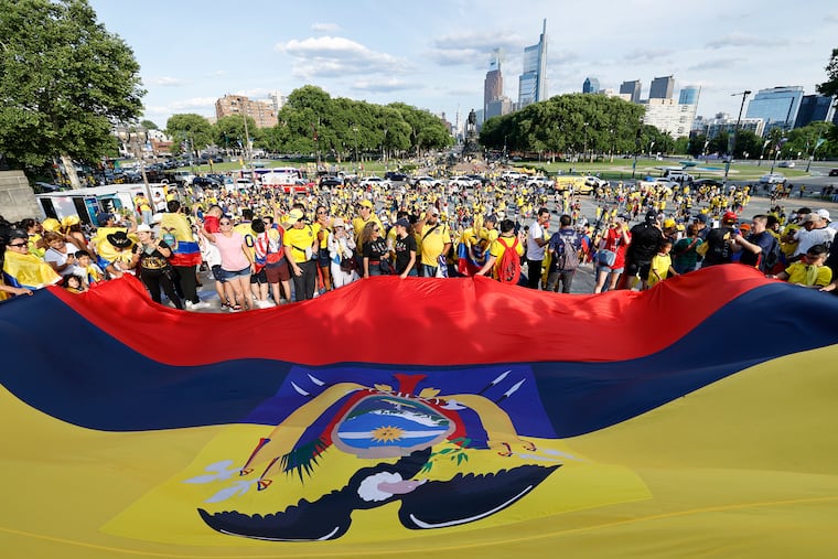 Ecuadorian soccer fans attend a flag-waving event at the Philadelphia Museum of Art steps along the Benjamin Franklin Parkway on Saturday, ahead Ecuador's first round World Cup match against the Ivory Coast.