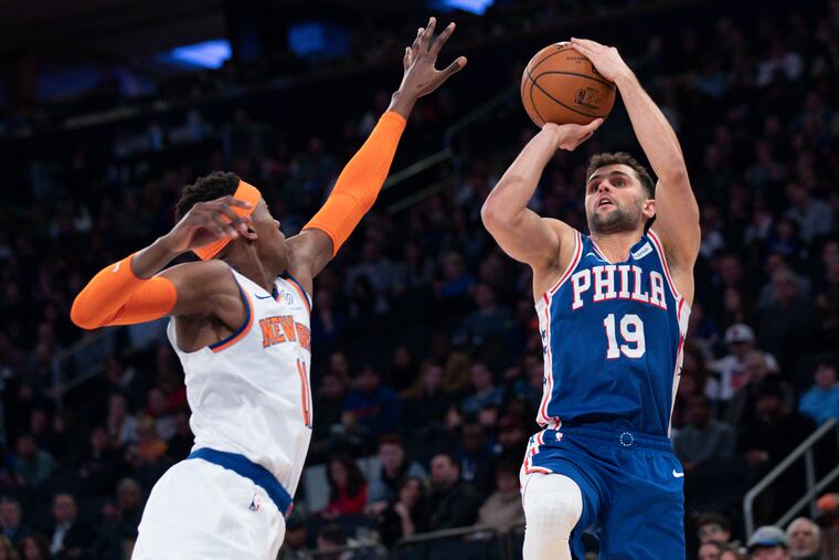 Raul Neto (19) shoots over Frank Ntilikina (11) during the Sixers-Knicks game at Madison Square Garden last month.