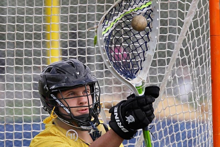 Goalie Paul Thiergartner warms up to play the second half. ( MICHAEL S. WIRTZ / Staff Photographer )