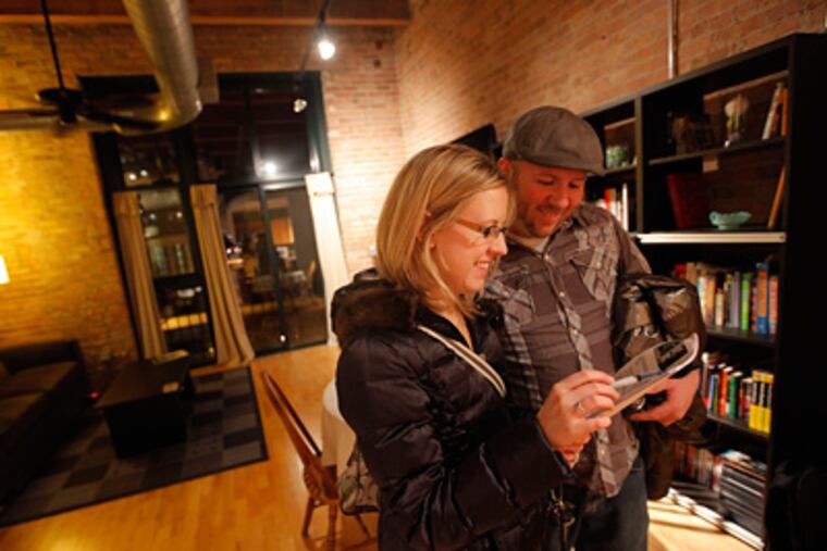 Kristy Fender and Dan Harvey look at a condo for sale in Chicago. (Terrence Antonio James/ Chicago Tribune/MCT)