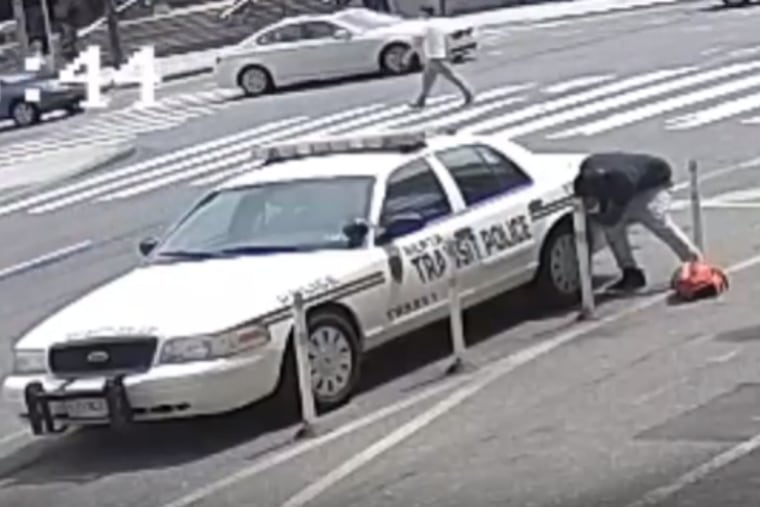 Police say this man slashed tires on police cars near City Hall two days in a row.