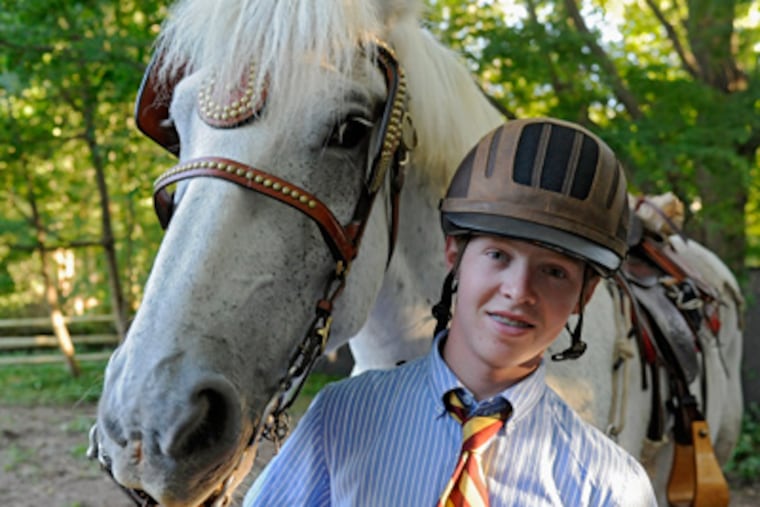 Portrait of Roby Burch, 16, and his horse Jet after school at The Haverford School. Burch will no longer ride the horse to school. (File Photo / Staff)