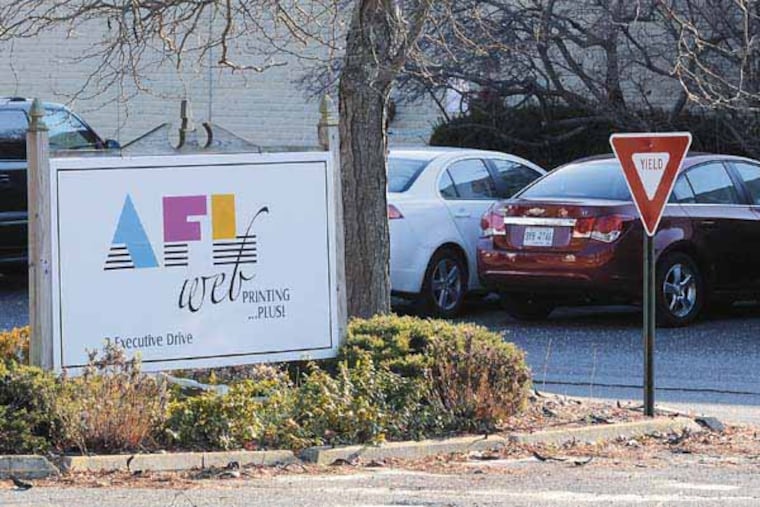 AFL Web Printing in Voorhees December 5, 2012, on last day for the company which printed newspapers, guide books, and coupon books, among other publications. It was acquired tow years by a venture capital firm that said it was in for the long-term. About 200 employees are out of work. Photo made from public area across the street. ( TOM GRALISH / Staff Photographer )