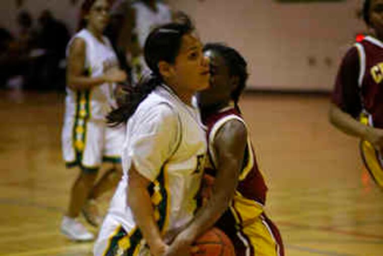 Edison's Jeyshalee Candelario is fouled by Central's Najah Jacobs (right). Jacobs had 19 points in Central's 68-28 win.