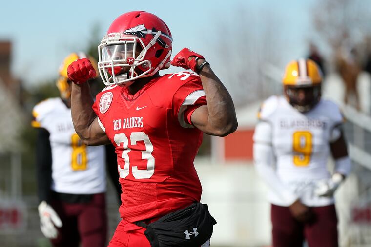 Paulsboro's Bhayshul Tuten (33) celebrates his touchdown in the first quarter. He supplied the ground game in the victory over Glassboro.