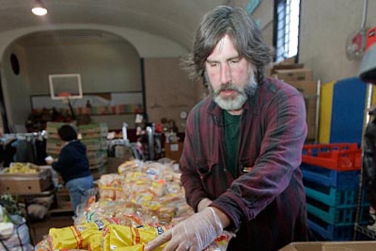 Steve Raiken, who is on welfare, volunteers at the Touch New Jersey food bank. (Bonnie Weller / Staff Photographer)