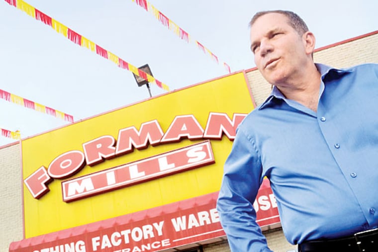 Rick Forman, founder, CEO, president poses outside the Forman Mills store on Route 130 in Pennsauken. ( TOM GRALISH / Staff Photographer )