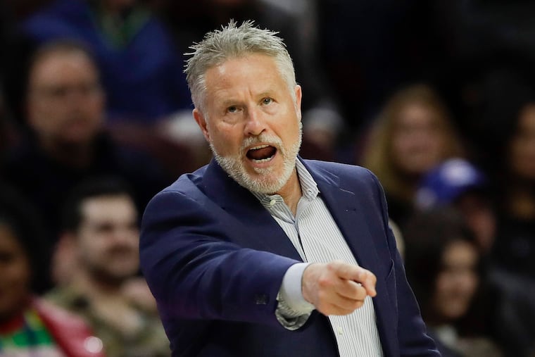 Sixers Head Coach Brett Brown points to his team.