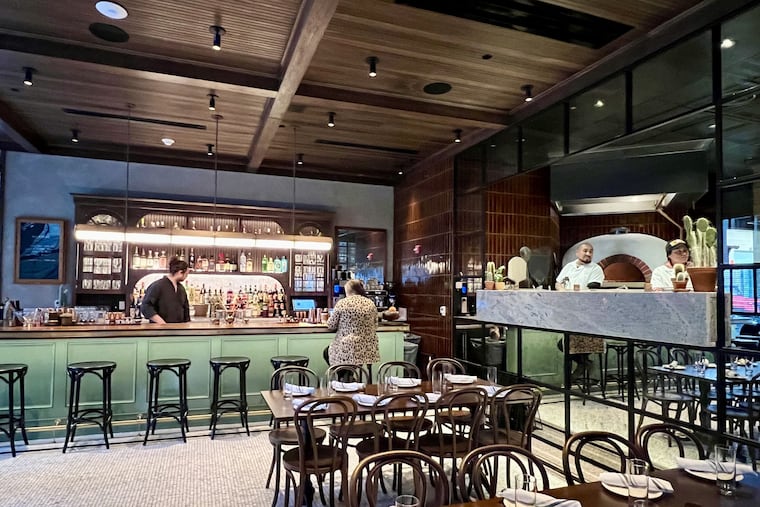 Bar, with open kitchen at right, at Mulherin's Pizzeria, 1175 Ludlow St., on April 6, 2024.