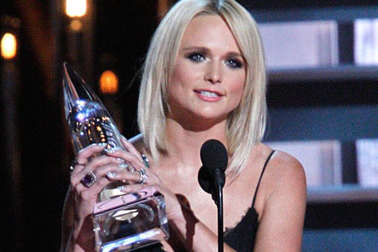 Miranda Lambert accepts the album of the year award for "Platinum" at the CMA Awards. ( WADE PAYNE / Invision / AP)