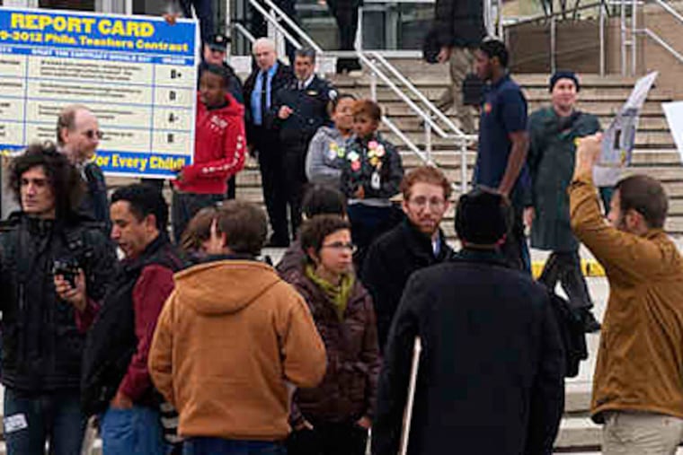 Two disparate groups were outside the Board of Education yesterday to criticize the new contract. (Ed Hille / Staff)