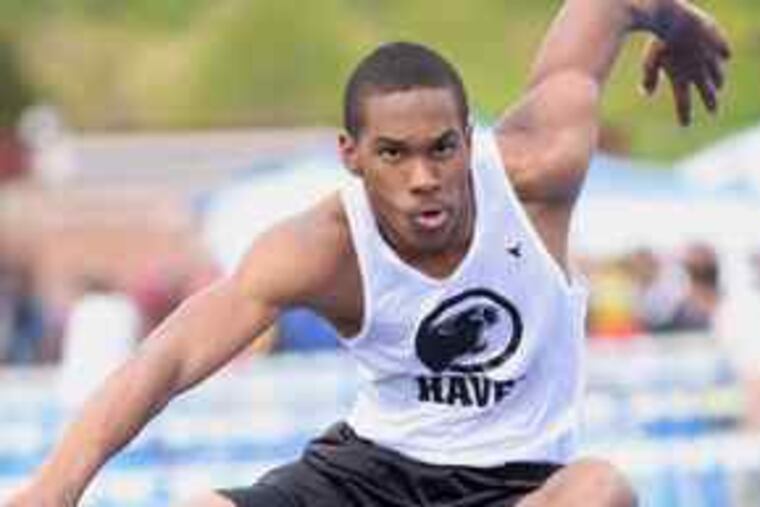 Strath Haven's James Griffin clears a hurdle during the shuttle relay. Strath Haven's girls' team was dominant at the meet.