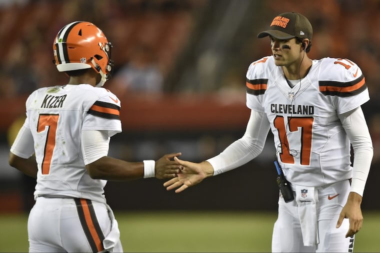 Cleveland Browns quarterback Brock Osweiler (17) congratulates quarterback DeShone Kizer after a Browns touchdown during the second half of an NFL preseason football game, Thursday, Aug. 10, 2017, in Cleveland. (AP Photo/David Richard)