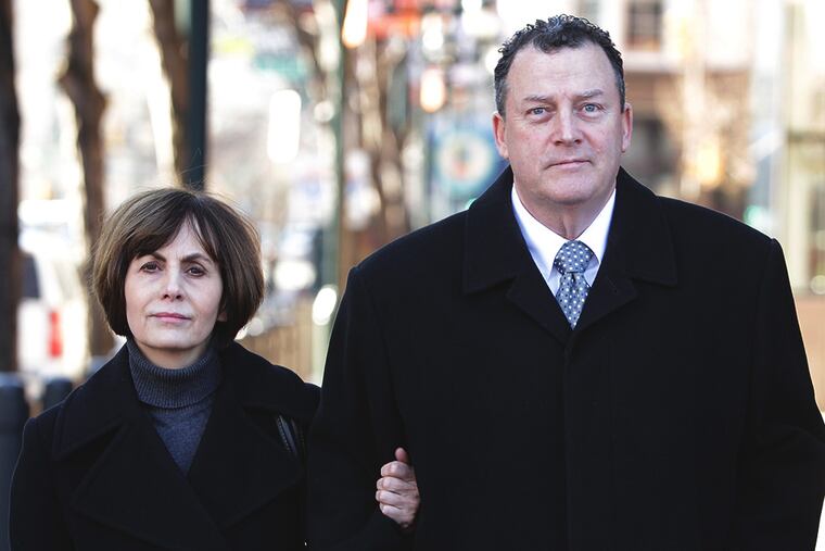 Former Traffic Court Judge Robert Mulgrew, right, with his wife, Elizabeth, leaves the Federal Courthouse on February 6, 2014. Mulgrew has pleaded guilty to defrauding a South Philadelphia nonprofit and to filing false tax returns. ( DAVID MAIALETTI / Staff Photographer )
